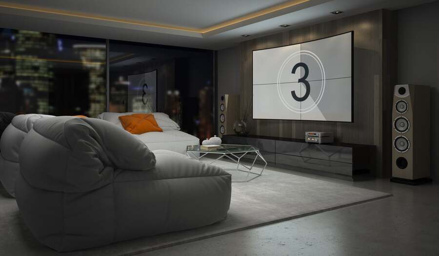 A home theater with a surround sound system and large-screen TV on the wall.
