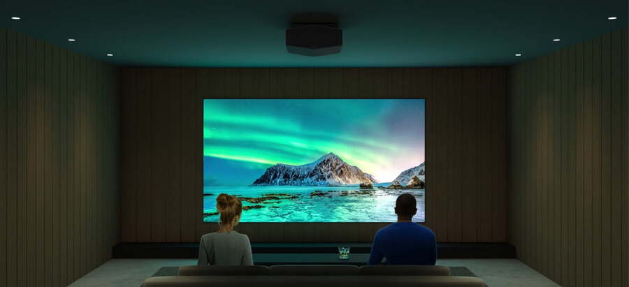 A man and a woman watch a high-resolution picture of a landscape with Sony’s XW6000ES projector.